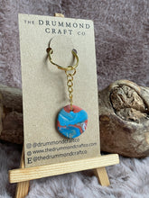 Load image into Gallery viewer, Turquoise on rust orange “no waste” keyring (gold)