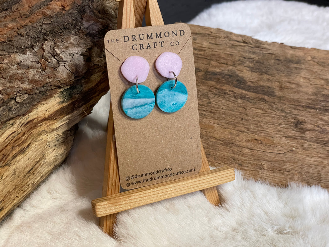 Pale pink and turquoise “wave” drops